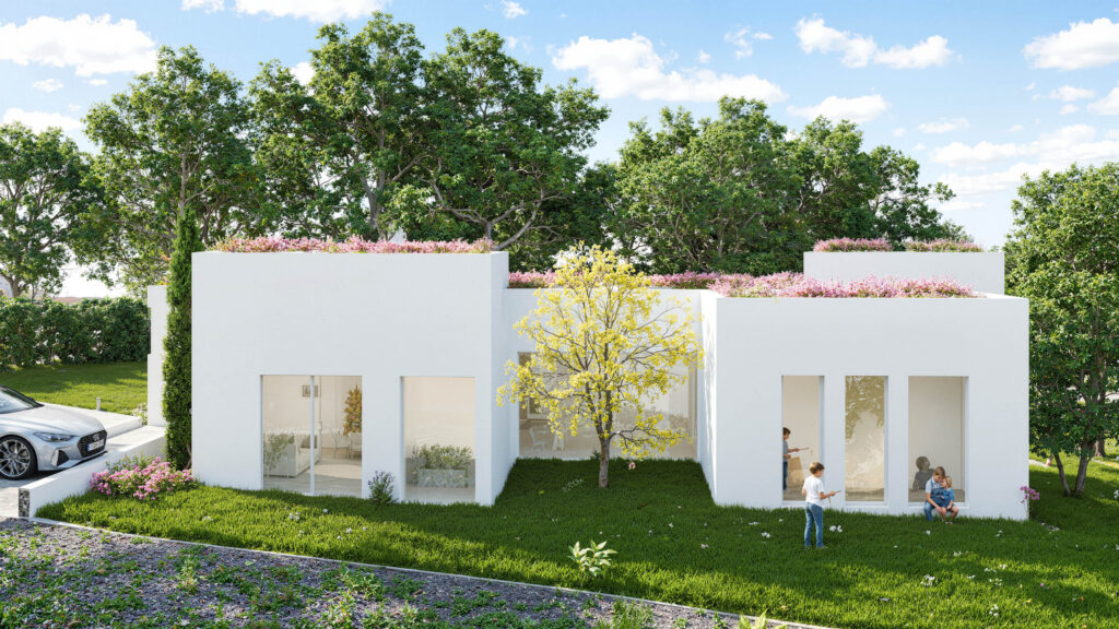 La imagen muestra la envolvente de Isla Sicilia, una vivienda industrializada proyectada con estructura Steelframe por EXarchitects. El diseño aprovecha el desnivel del terreno para volcar la casa hacia un jardín escalonado con vistas al paisaje natural de El Casar.